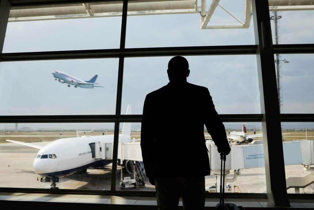 airplane travel or silhouette man watch plane fly 2026 01 09 09 39 15 utc scaled.jpg