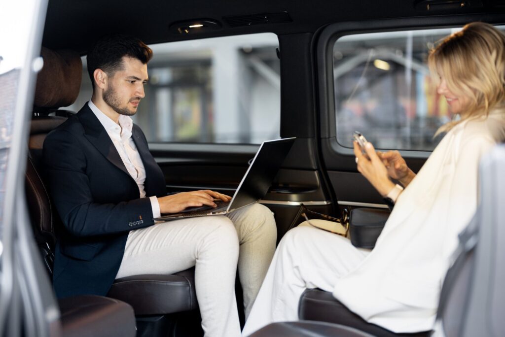 business people sitting in minivan taxi 2026 01 08 07 49 16 utc scaled.jpg